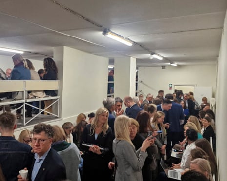 People gather inside a shelter at the Lithuanian parliament after an ‘air danger’ warning, in Vilnius, Lithuania.