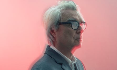 David Byrne in profile with dark-rimmed glasses