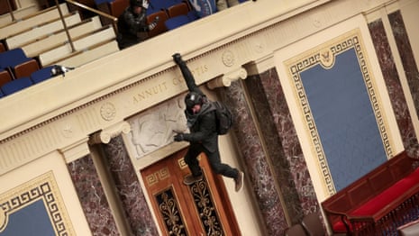 Members of pro-Trump mob wander Senate floor after swarming Capitol – video