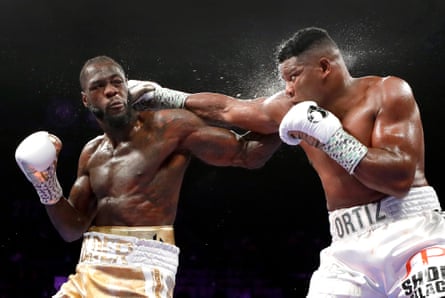 Deontay Wilder, left, made 10 heavyweight title defenses, more than Mike Tyson and Joe Frazier, including two against Luis Ortiz.