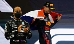 Abu Dhabi Grand Prix - 12 December Red Bull’s Max Verstappen celebrates winning the title as Mercedes’ Lewis Hamilton offers his applause.
