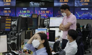 Currency traders watch monitors at the foreign exchange dealing room of the KEB Hana Bank headquarters in Seoul, South Korea.