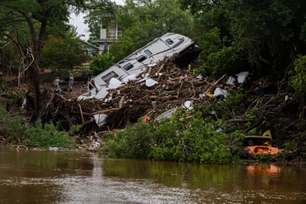 upturned motor home on riverbank