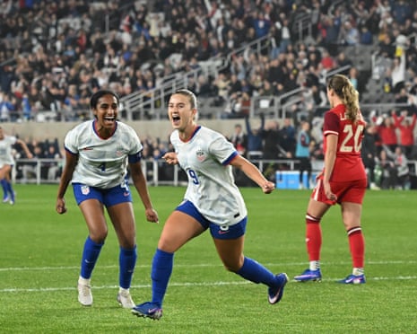The USWNT celebrating after a goal