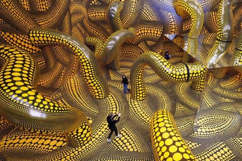 People in a large immersive artwork.