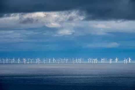 Turbines of an offshore windfarm on the horizon in the Irish Sea