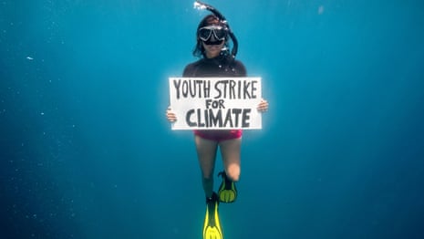 Activist dives for global climate strike in first underwater protest for the planet – video