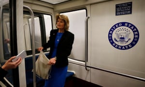 Republican senator Lisa Murkowski speaks with the media as she boards the US Capitol subway system on Wednesday.