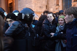 Police officers detain demonstrators in St Petersburg following calls to protest against the partial mobilisation announced by president Vladimir Putin