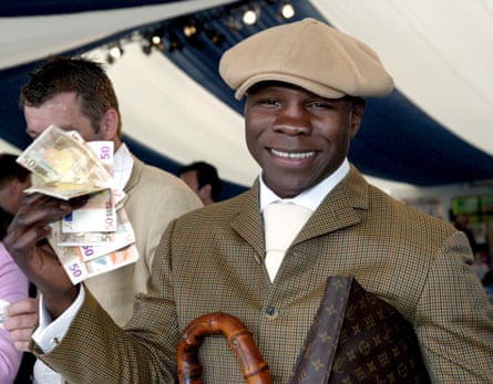 Chris Eubank holding a fistful of UK banknotes