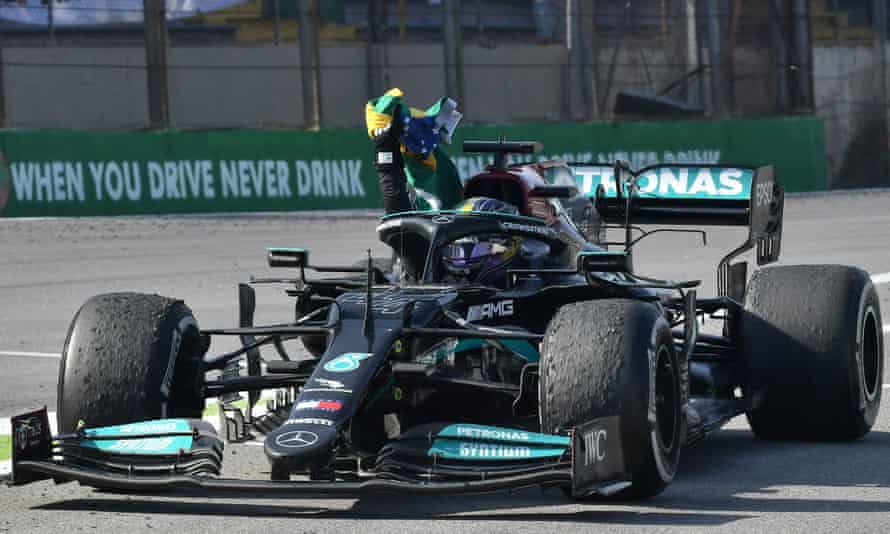 Lewis Hamilton with a Brazilian flag on his in-lap after his momentous victory