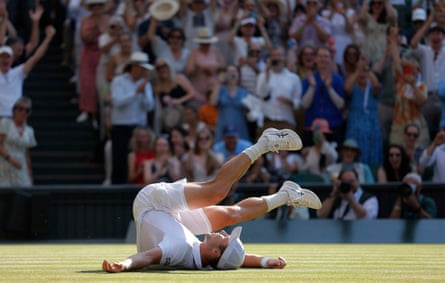 Arthur Fery falls on the grass on Centre Court.