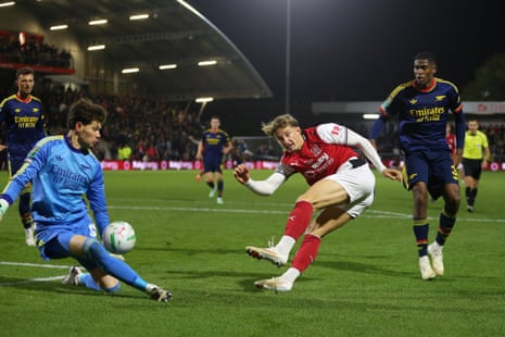 Will Davies of Fleetwood forces a save from Arsenal keeper Illan Meslier.