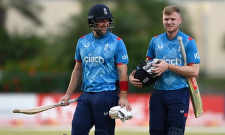 Liam Livingstone leaves the field with Dan Mousley