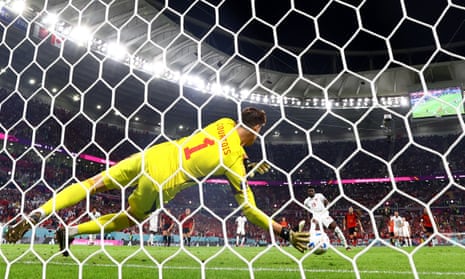 Canada's Alphonso Davies has his penalty saved by Belgium's keeper Thibaut Courtois.