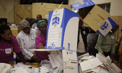 Election officials start the ballot counting process at a polling station during local elections in Manenberg on the outskirts of Cape Town, South Africa.
