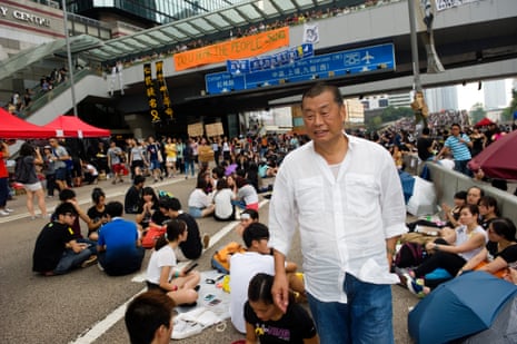 immy Lai, CEO of Next Media and famous critic of Beijing policies, stands in the crowd taking part in a sit-in called ‘Occupy Central’ or ‘Umbrella revolution’ in Connaught road, Admirality, Hong Kong, on October 2, 2014.