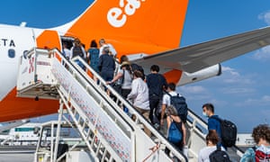 Passengers prepare to board an easyjet flight at Rome Fiumicino Airport bound for London Gatwick Airport.