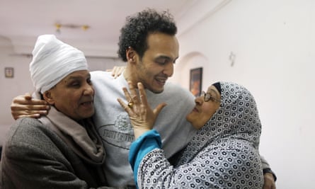 Mahmoud Abu Zaid is hugged by his parents.
