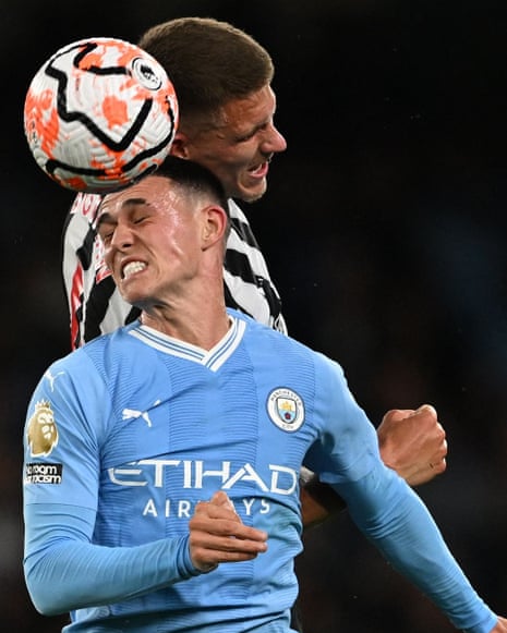 Manchester City's English midfielder #47 Phil Foden heads the ball with Newcastle United's Dutch defender #04 Sven Botman (back) during the English Premier League football match between Manchester City and Newcastle United at the Etihad Stadium