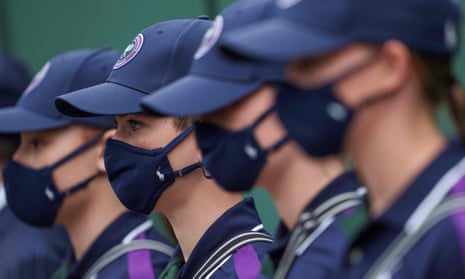TENNIS-GBR-WIMBLEDON<br>Ball Boys and Ball Girls wearing a face covering to combat the spread of coronavirus, are pictured on the third day of the 2021 Wimbledon Championships at The All England Tennis Club in Wimbledon, southwest London, on June 30, 2021. (Photo by AELTC/Jed Leicester / POOL / AFP) / RESTRICTED TO EDITORIAL USE (Photo by AELTC/JED LEICESTER/POOL/AFP via Getty Images)