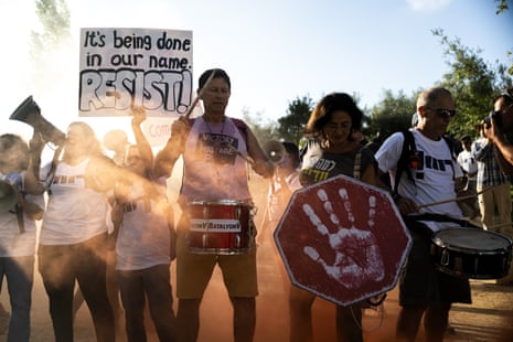 People gather around the National Library of Israel to stage a demonstration demanding a ceasefire in Gaza, the release of Israeli hostages and the resignation of Israeli prime minister Benjamin Netanyahu and his government, in Jerusalem.