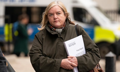 Louise Casey carrying a copy of her report on the Metropolitan police