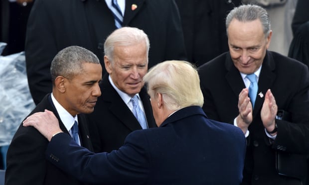 Chuck Schumer looks on as Donald Trump talks to Barack Obama and Joe Biden at the 2017 inauguration ceremony.