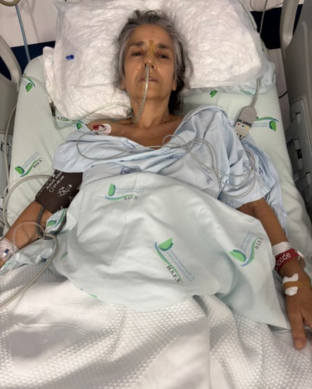 Cabral in hospital bed with drips attached