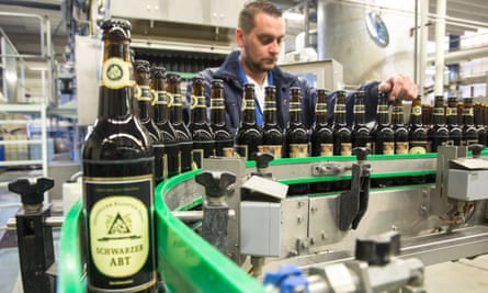A brewery worker checks bottles of Klosterbrauerei Neuzelle’s Schwarzer Abt (Black Abbot) beer.