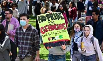 Pro-Palestinian students march and hold signs as they protest Israel’s war on Gaza at the University of Southern California in Los Angeles, on 24 April 2024.