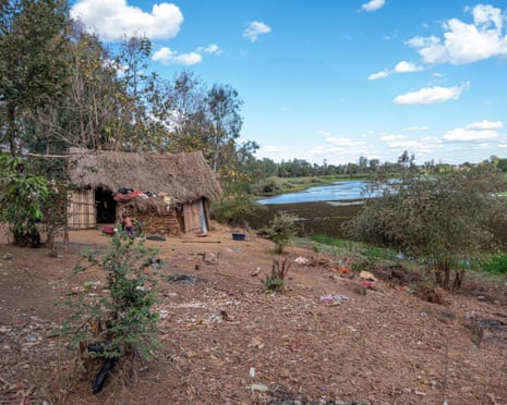 A view of Odette’s family home - a rudimentary hut on the bank of a river