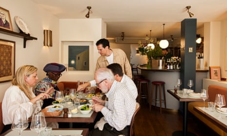 July restaurant in central London, four diners being served