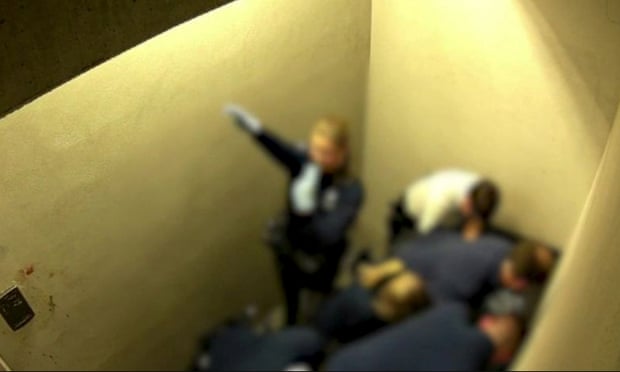 A video image shows a police officer apparently giving a Nazi salute while Jozef Chovanec was held down