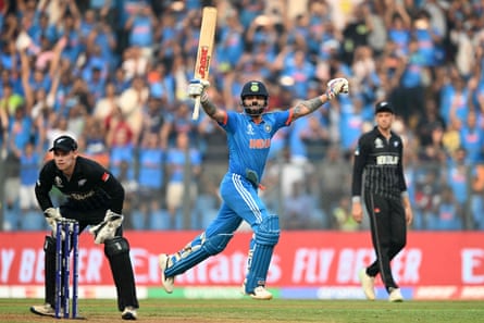 India’s Virat Kohli celebrates his record-breaking 50th ODI century.