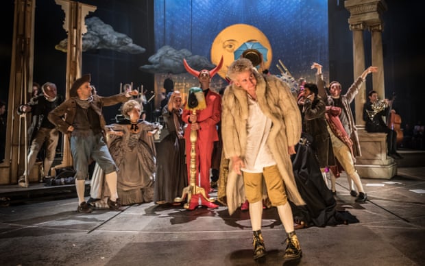 Adam Gillen as Mozart with players in Michael Longhurst’s Amadeus at the National Theatre.
