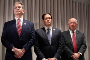 The three men standing next to each other
