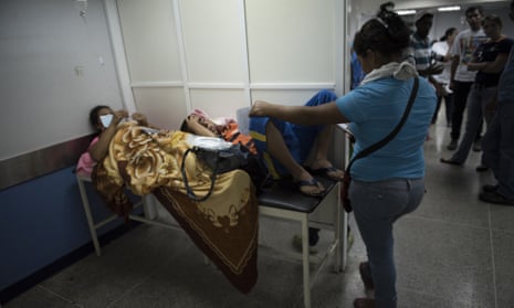 Two patients share a gurney at a hospital Barquisimeto. Healthcare provision has only deteriorated since this picture was taken in 2106.