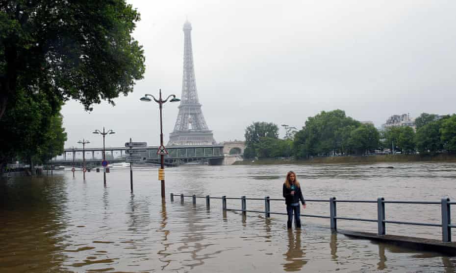 Water rises near the Eiffel Tower as the Seine river's embankments overflowed after days of heavy rain in Paris, France, June 2016, during the hottest ever on record.