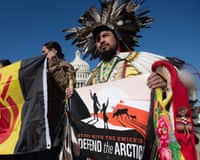 Native American leaders hold signs against drilling in the Arctic Refuge of the Arctic National Wildlife Refuge.