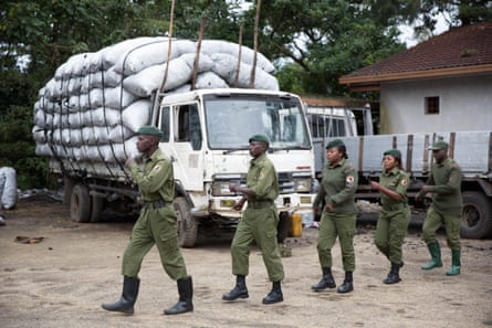 Rangers on parade. Behind them is a truck loaded with illegal charcoal that was confiscated.