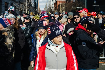 crowd of Trump supporters wait in line