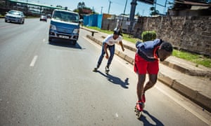 Lenny Alvin drafts behind Allan Ayigah on Nairobi’s Thika superhighway.