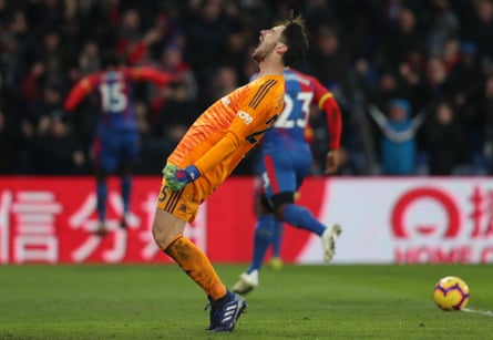 February 2: Sergio Rico of Fulham reacts in dismay as Jeffrey Schlupp of Crystal Palace celebrates scoring.
