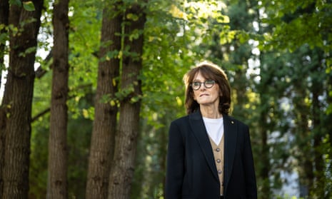 Dr Cathy Foley surrounded by trees