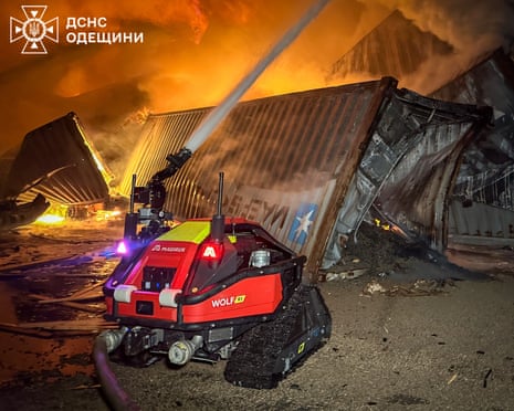 A small robot spraying water on a fire