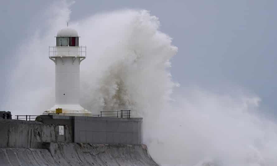 Huge waves whipped up by the strong wind crash over the South Gare lighthouse near Redcar on Sunday