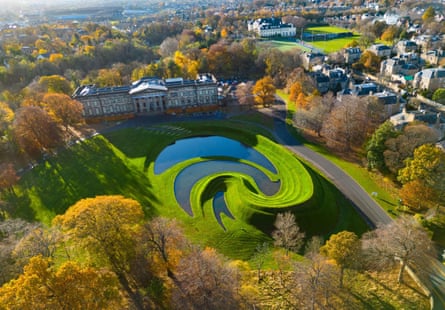 An aerial view of Charles Jencks’s huge land sculpture of curving ponds and grassy hills.