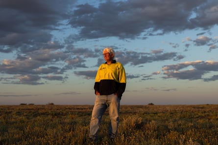 Trevor Wright stands on a ridge overlooking William Creek