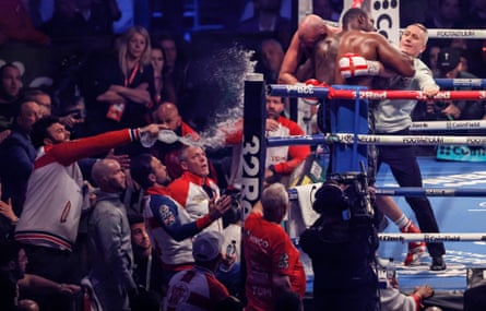 A member of Tyson Fury’s corner throws water on the two fighters during the WBC heavyweight title fight.